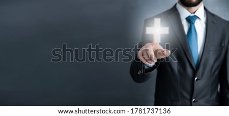 man touching in cross in the screen
