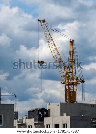 Construction crane for the construction of blocks of apartment buildings, new buildings, renovation and modernization, improvement of the urban environment