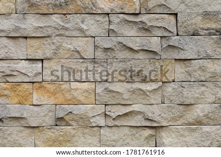 The wall is made of decorative wild stone. Background or graphic resource.