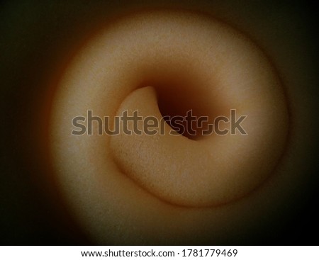 abstract creamy sponge foam roll with black background is blurred