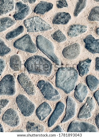 Stone in concrete rough background surface