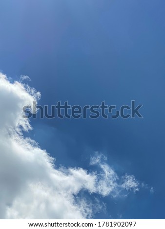Beautiful blue sky with white clouds on sunny day.