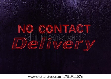 No Contact Delivery Neon Sign in Rainy Window