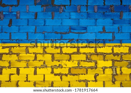 The national flag of Ukraine painted on a wall of sibit blocks with cement . The symbol of the country.