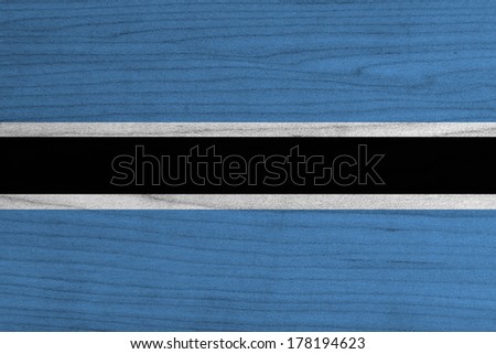 Botswana Flag on wood background 