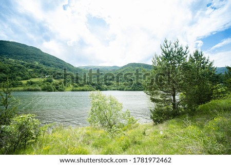 Photo of river and mountains. Beautiful peaceful destination with fresh air and clean water