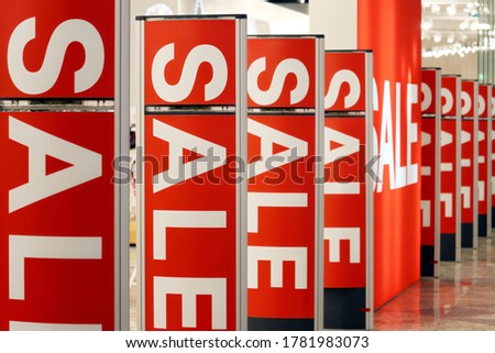 Sale signs on light boards in a store. Concept of shopping, sales, discounts
