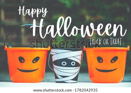 Happy Halloween, trick or treat text. Child Trick or Treat Empty Halloween Buckets are Ready for the Candy Treats, Jack-o'-lantern pumpkin and Mummy Style toy baskets