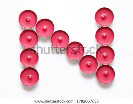 pink candles on a white background