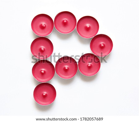 pink candles on a white background