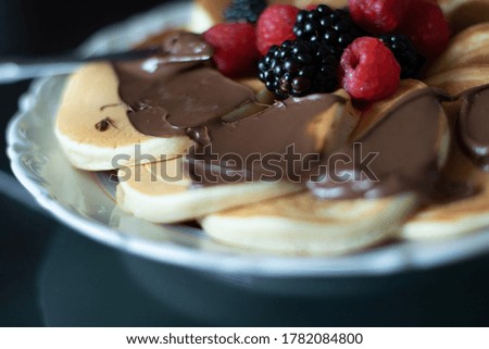 chocolate and fruit pancakes in the plate