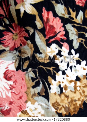 An old textile background with pink and white flowers