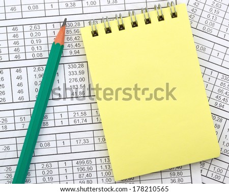 Image yellow notebook on background of numbers/Notebook on the background of digits