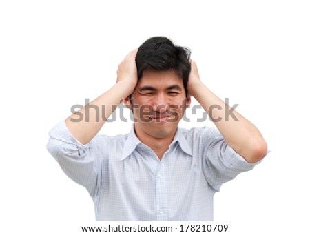 An asian man hold his head as headache as isolated picture