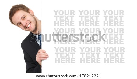 Young businessman holding a whiteboard. Concept - a demonstration of achievements in business, graphic ads. Isolated on white.