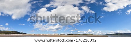 A panorama of the beautiful summer sky as viewed from the coast of Llandudno, North Wales, United Kingdom.