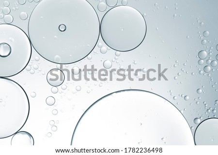 Cosmetic liquid or water serum on white background