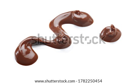 Melted milk chocolate, arranged in the shape of them, with a drop of chocolate alongside, resting on a white background.