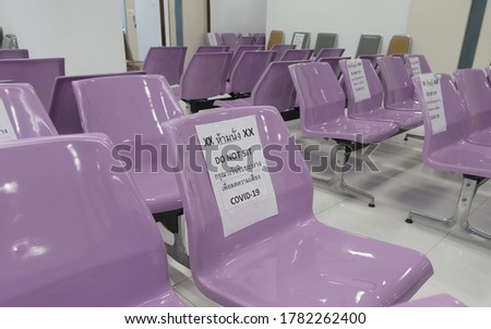 Caution, Social Distancing Purple chair for waiting at the hospital with copy space.
