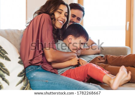 Young family having fun at home Royalty-Free Stock Photo #1782268667