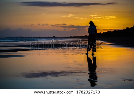 Beautiful silhouette image of Kid playing and enjoying at the Beach in Costa Rica