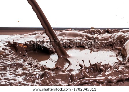 splashing hot chocolate, isolated on white background
