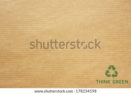 Green recycle symbol on wrapping paper, texture or background
