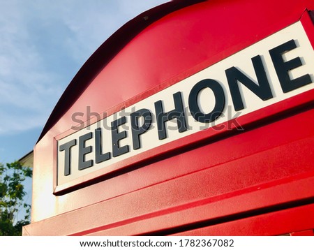 Red old traditional retro and vintage classic style of telephone box booth for the concept of communication technology and other used