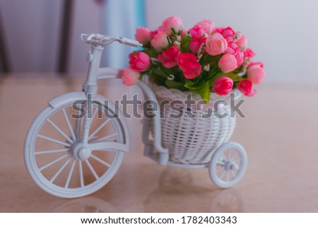 interior decoration of the registry office, small decorative roses in a bicycle basket