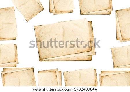 texture background with vintage blank sheets of paper or postcards yellowed with old age, top view
