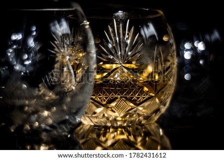 glass goblet with whiskey .