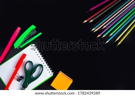 Set of stationery on a black background. Back to school concept. Place for text.