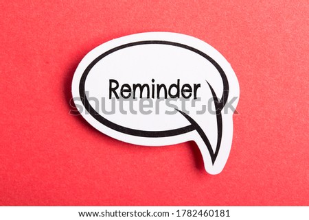 Reminder speech bubble isolated on the red background.