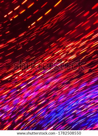 A light trail of some christmas lights, caused by waving my camera from side to side. 