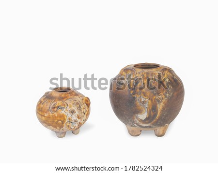 Two ancient Sangkhalok ceramic wares elephant shape, Si Satchanalai style, 13th.-17th. Century. isolated on white background.