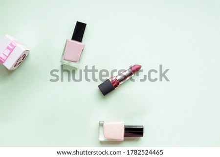 woman makeup beauty products from above on pastel background. Trendy flat lay fashion and beauty retail products, copy space.care of nails and cuticle, lips.Nail art concept. Fine art cosmetics
