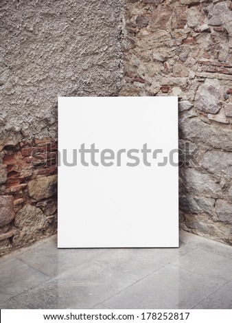 Stone wall and white poster