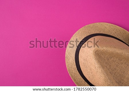 Top above overhead view photo of a hat isolated on pink background