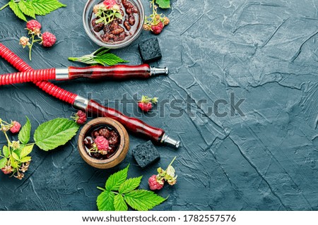 Oriental hookah with tobacco with the aroma of raspberry jam.Eastern shisha.Copy space
