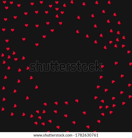 Frame of red hearts fly apart on a black background