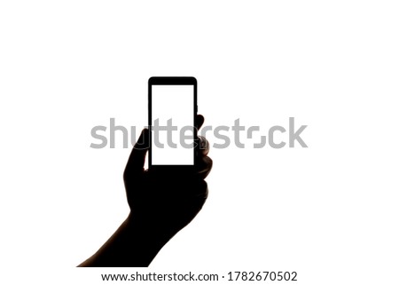 Silhouette of hand with smartphone taking picture isolated on white background. Screen with copy space. Blank or mock-up for design.
