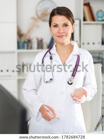 Portrait of polite female health worker meeting patient in medical office