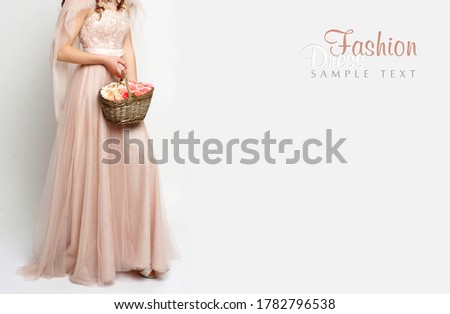 Fashion pink dress. Holiday. Flowers. Basket with roses