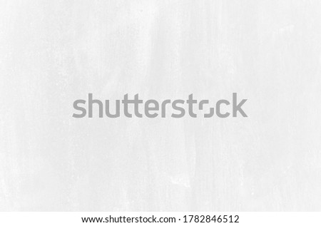 Subtle white washed out wall texture background. Cool light soft grey pattern of concrete or cement surface. Abstract template for print or design.