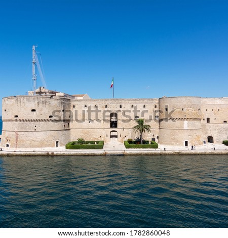 frontal view of the aragonian castle in taranto on blue sky background in summer