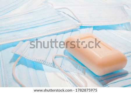 Medical masks and a piece of soap as protection against coronavirus and other infections