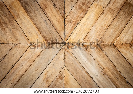 seamless brown color lumber in arrows or chevron pattern to the center. top view