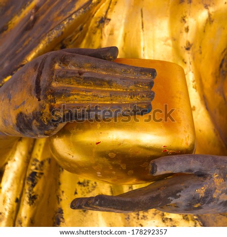 Golden ancient statue of Buddha.