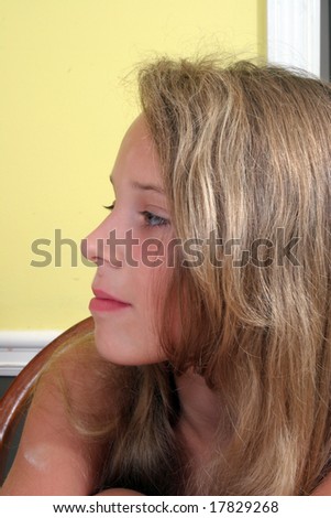 Pretty blond girl with serious expression