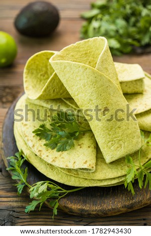 
Green spinach tortilla on the wooden table